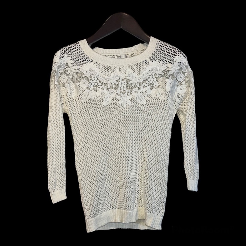 Lauren Conrad loose knit - light sweater with floral just below the neckline.